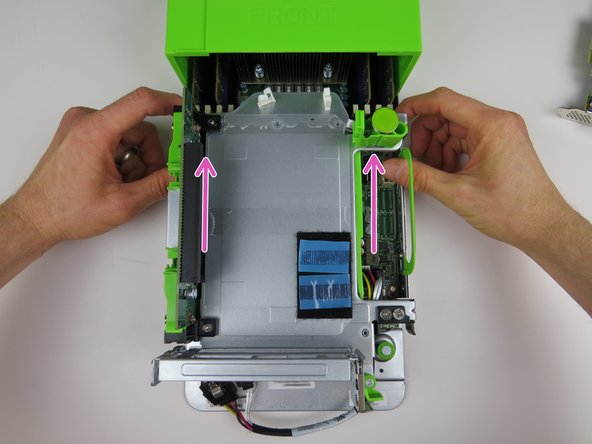 Lock the PCI Riser Cage by pushing the two handles towards the rear of the server until they click into place.