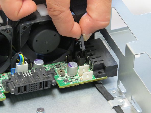 Make sure to pinch the LED retention cable tab before pulling it upwards.