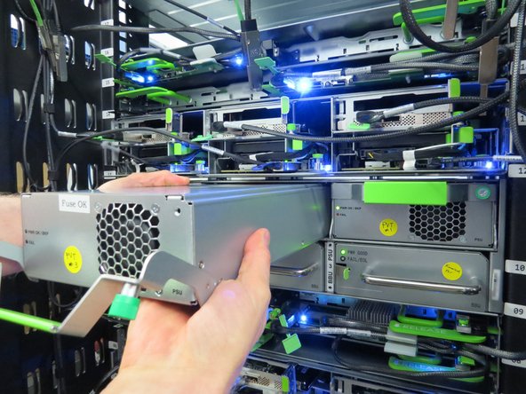 Continue pulling the PSU away from the rack until it has been completely removed.