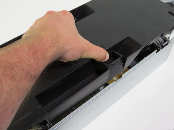 Install the lid on the server, as shown.