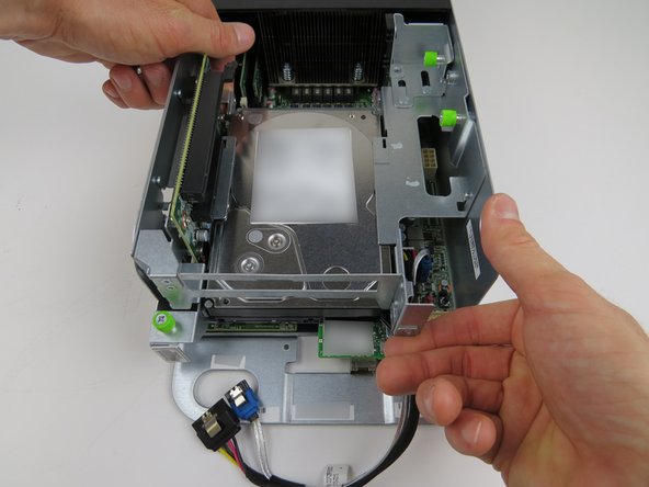 Pull the PCI riser card assembly upwards and remove the assembly from the server.