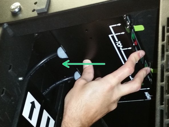 Slide the PDU towards the trough until the green latches snap into position.