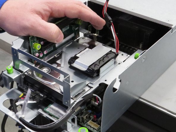 Push the RAID controller battery away from its retention clip.