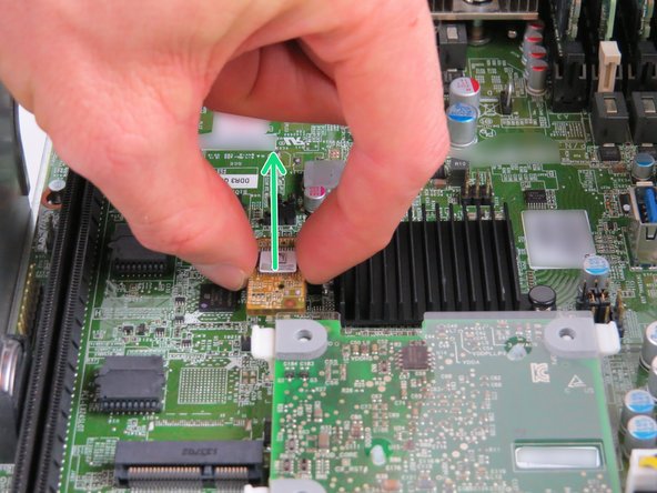 To remove, grip the module on each side, then pull upwards as shown.