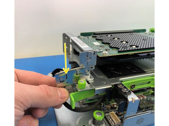 To remove the AVA M.2 carrier card by  unhooking the metal hook tab on the left side of the bracket.