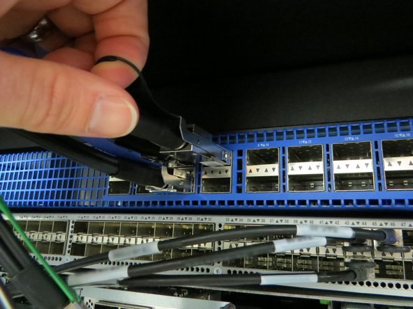 Connect the QSFP cables and direct-attach copper (DAC) breakout cables to the switch.