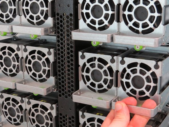 Engage the fan handle, as shown.