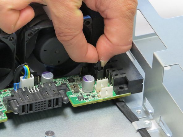 Make sure to pinch the LED retention cable tab before pulling it upwards.