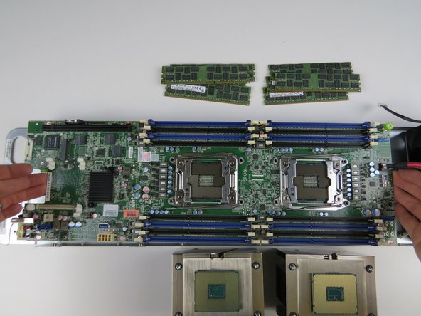 Lower the motherboard into the chassis.