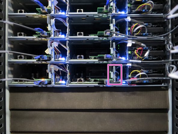 Press the button on the server sled release lever and pull the lever.