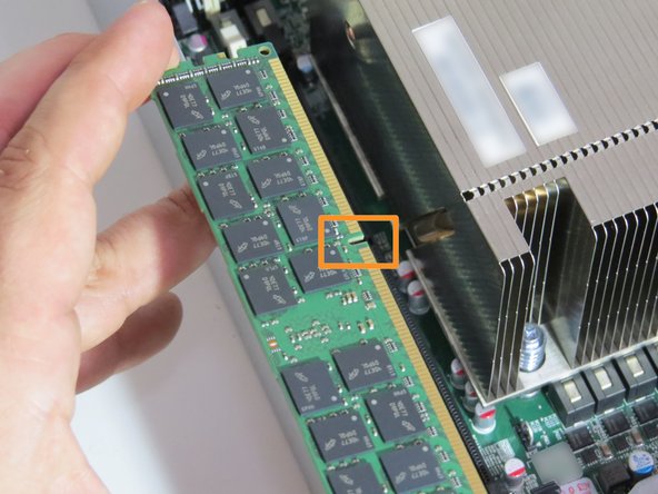 Align the DIMM and slot key.