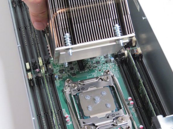 Lower the heatsink onto the CPU.
