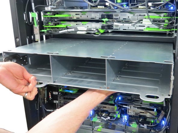 Place a hand underneath the chassis while removing it to counterbalance the weight.