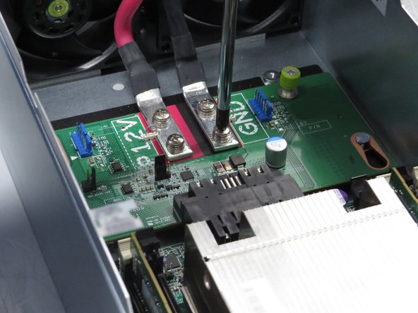 Unscrew (4) screws, as shown.