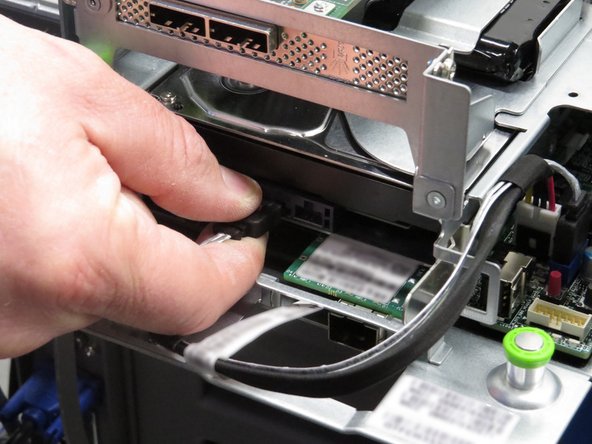 Insert a new HDD into the drive cage.