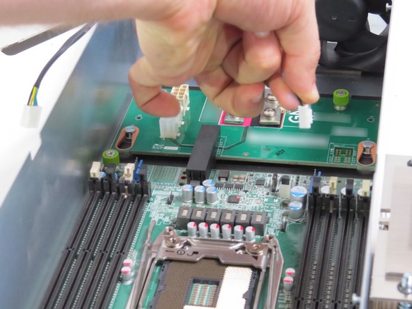 Disconnect (2) fan power cables.