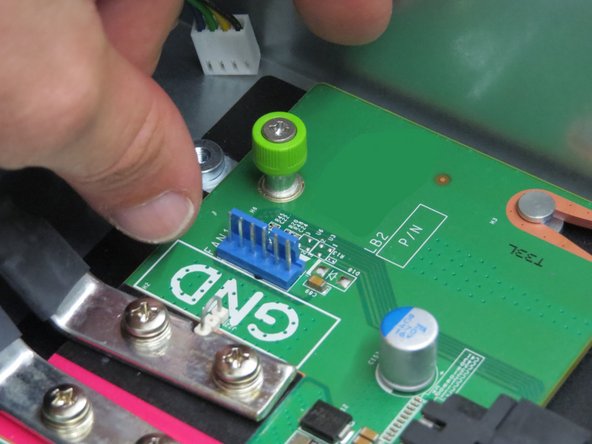 Use a Phillips #2 screwdriver if the thumbscrew is tight.