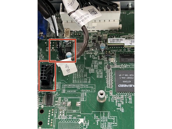 Disconnect both cables by grasping the plastic connector and pulling gently straight up.
