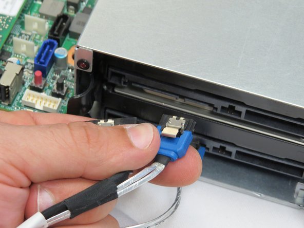 Disconnect the power and SATA connectors from the HDD.