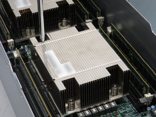 Continue to unscrew the screws holding the heat sink to the CPU until you can remove it.