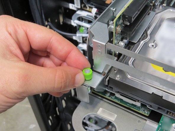 Loosen the (2) thumbscrews, shown.