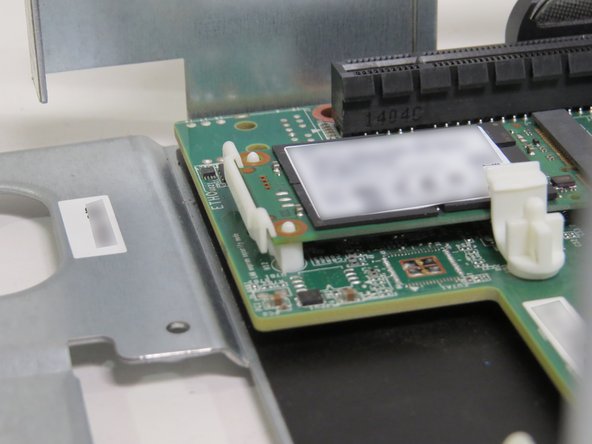 A 'click' can be felt when the mSATA drive is properly seated.