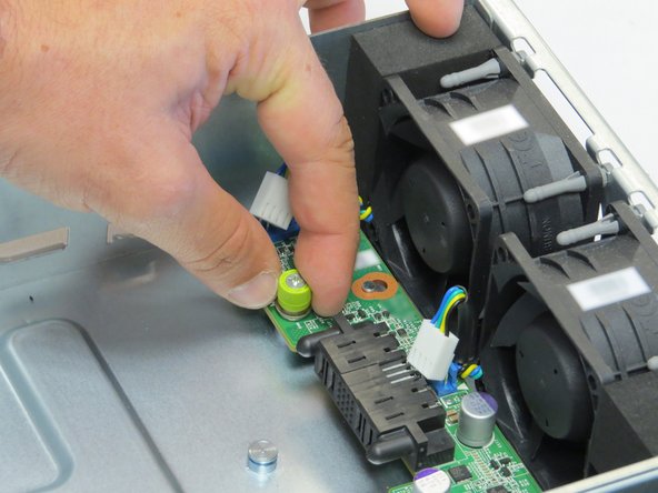 Loosen one thumbscrew.