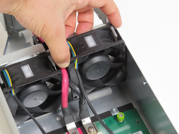 Lift the fan from the system.