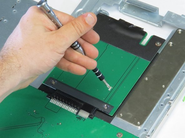 Unscrew (4) Phillips #1 screws.