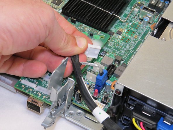 Disconnect the power connector from the server motherboard.