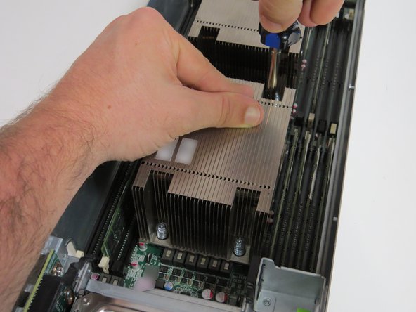 Loosen each screw halfway first (about two driver rotations). Proceed loosening the screws completely.