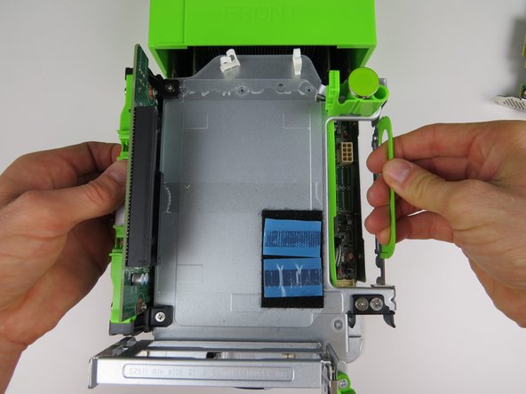 Lower the PCI Riser Cage onto the server chassis and press firmly to seat.