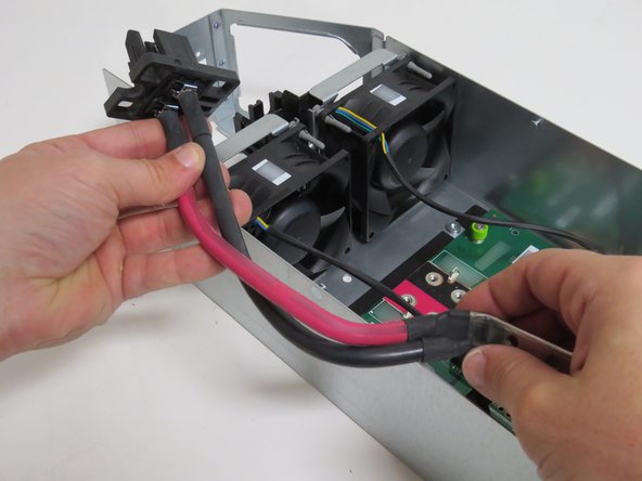 Place the bus lead retention bracket to the side to reuse.