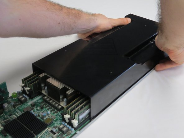 Push the lid towards the rear of the server.