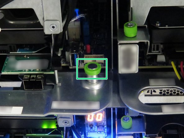 Pull the green retention plunger upwards.