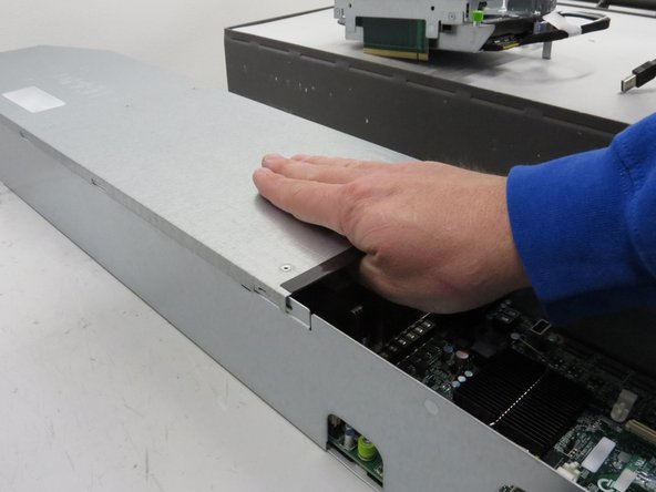 Install the lid on the server.