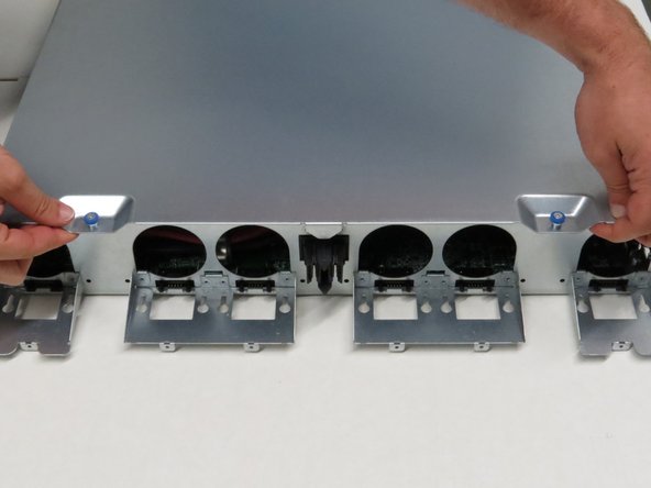 Pull the lid towards the rear of of the chassis.