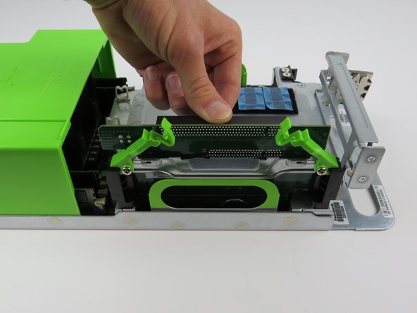 Firmly press the PCI riser card downwards to secure in socket.