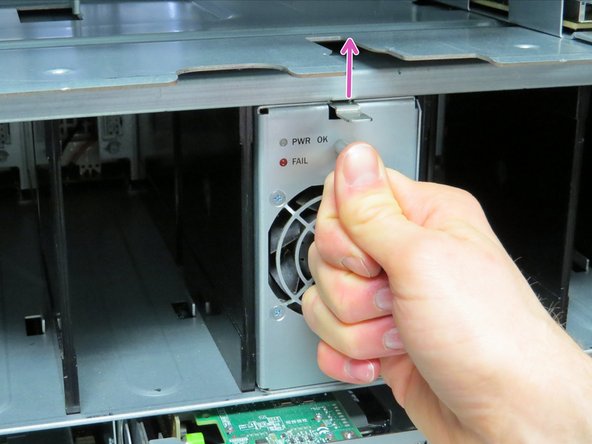 The power supply is seated correctly when the retention tab snaps upward.