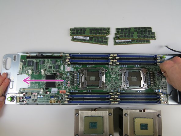 Slide the motherboard toward the front of the chassis until resistance is felt.