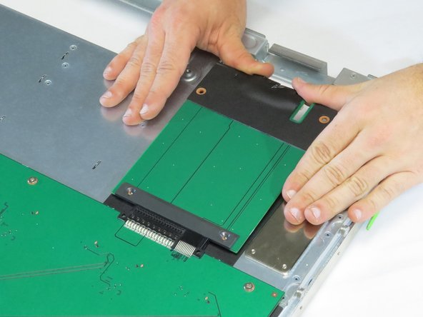 Push the board into its connector.