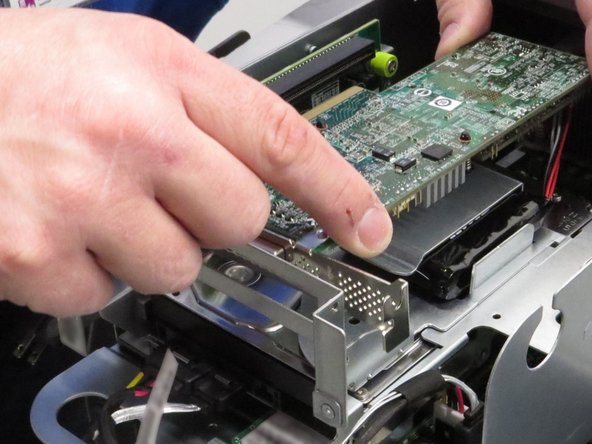 Pull the RAID controller from the PCI riser card socket.