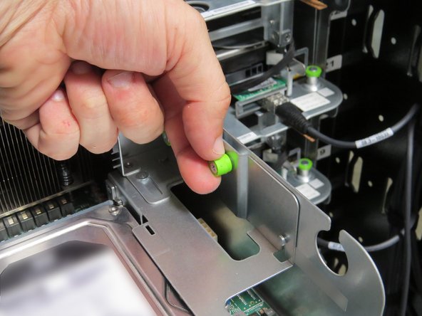 Loosen the (2) thumbscrews, shown.