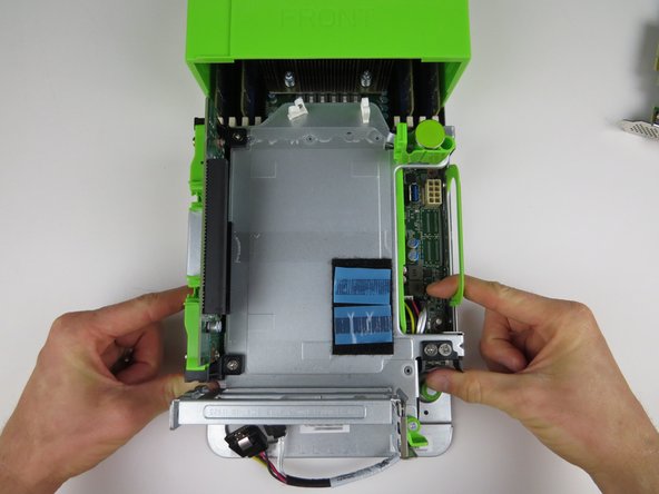 Pull the two PCI Riser Cage locking handles towards the front of the server, as shown.