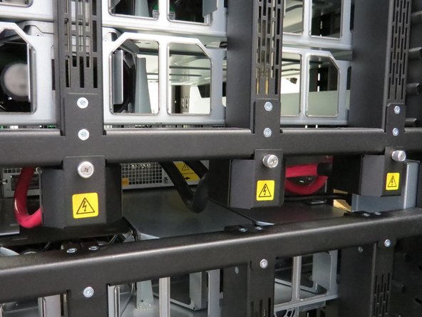 Install the three bus bar lead covers that were previously removed.