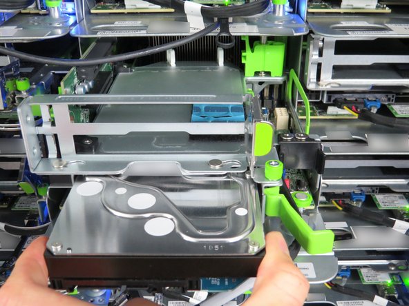 Place your fingers on each side of the HDD to remove it the rest of the way.
