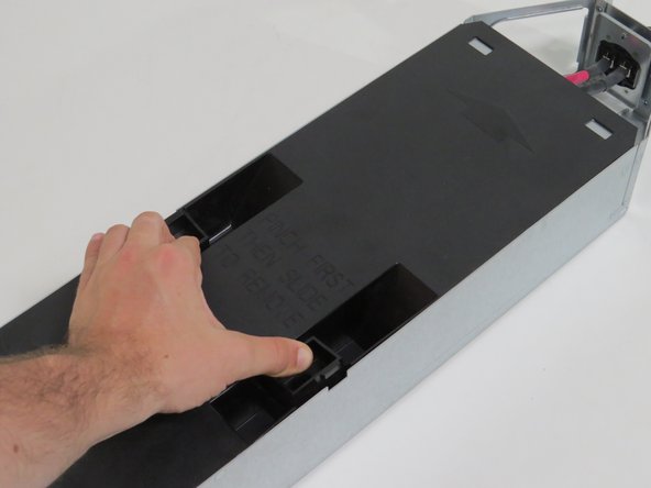 Slide the lid towards the rear of the server node.