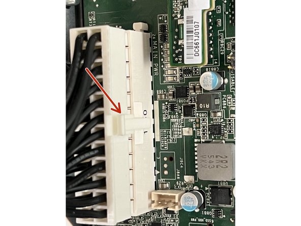 Pull the main GPU connector by depressing the top of the locking clasp and pulling the sides of the connector.