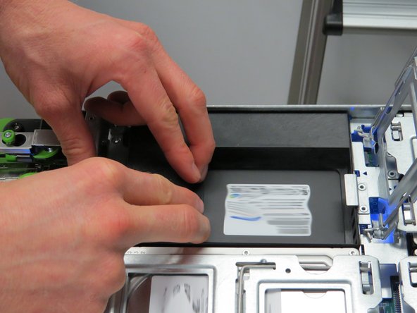 Lightly pull the SSD away from its connector.