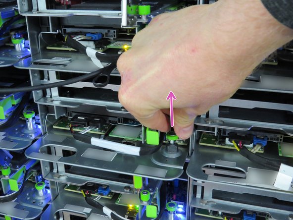 Using the handle located at the left side of the server sled, pull the sled outwards.